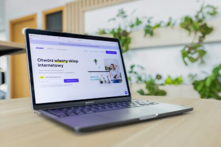 Person checking email on smartphone showing marketing campaign interface