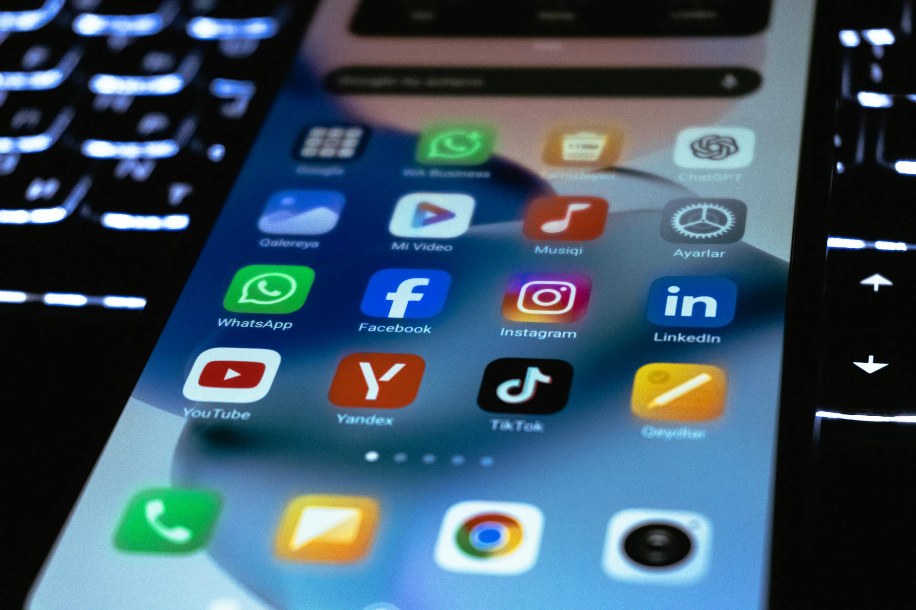 Person holding smartphone showing social media interface with engagement metrics visible on screen