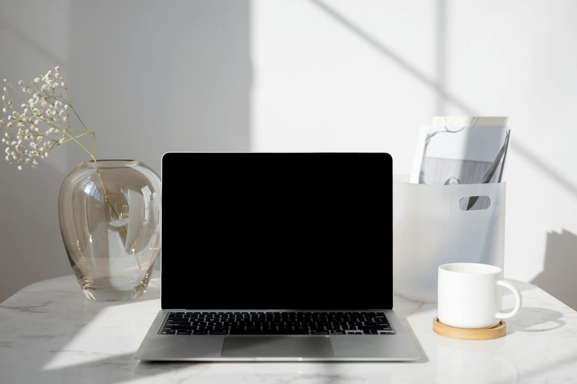 Clean laptop workspace setup for Pinterest business account management and seasonal campaign planning