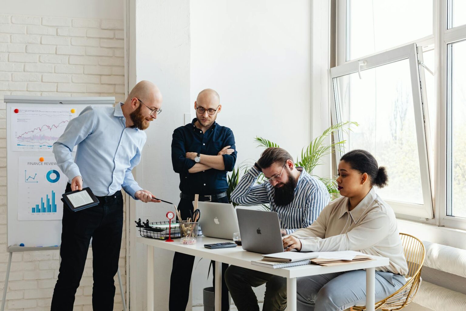 Business team collaborating around a conference table in modern office setting