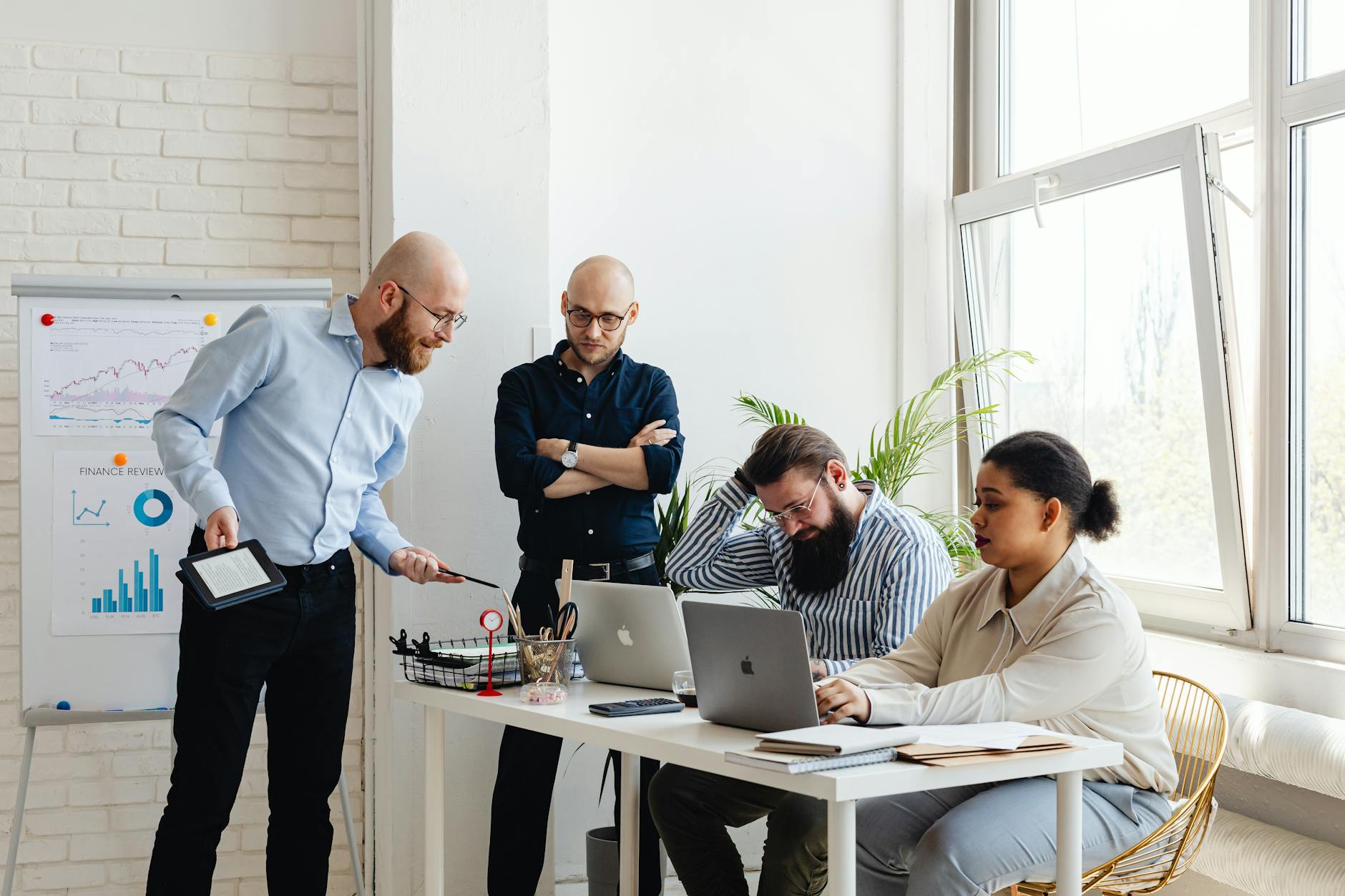 Business team collaborating around a conference table in modern office setting