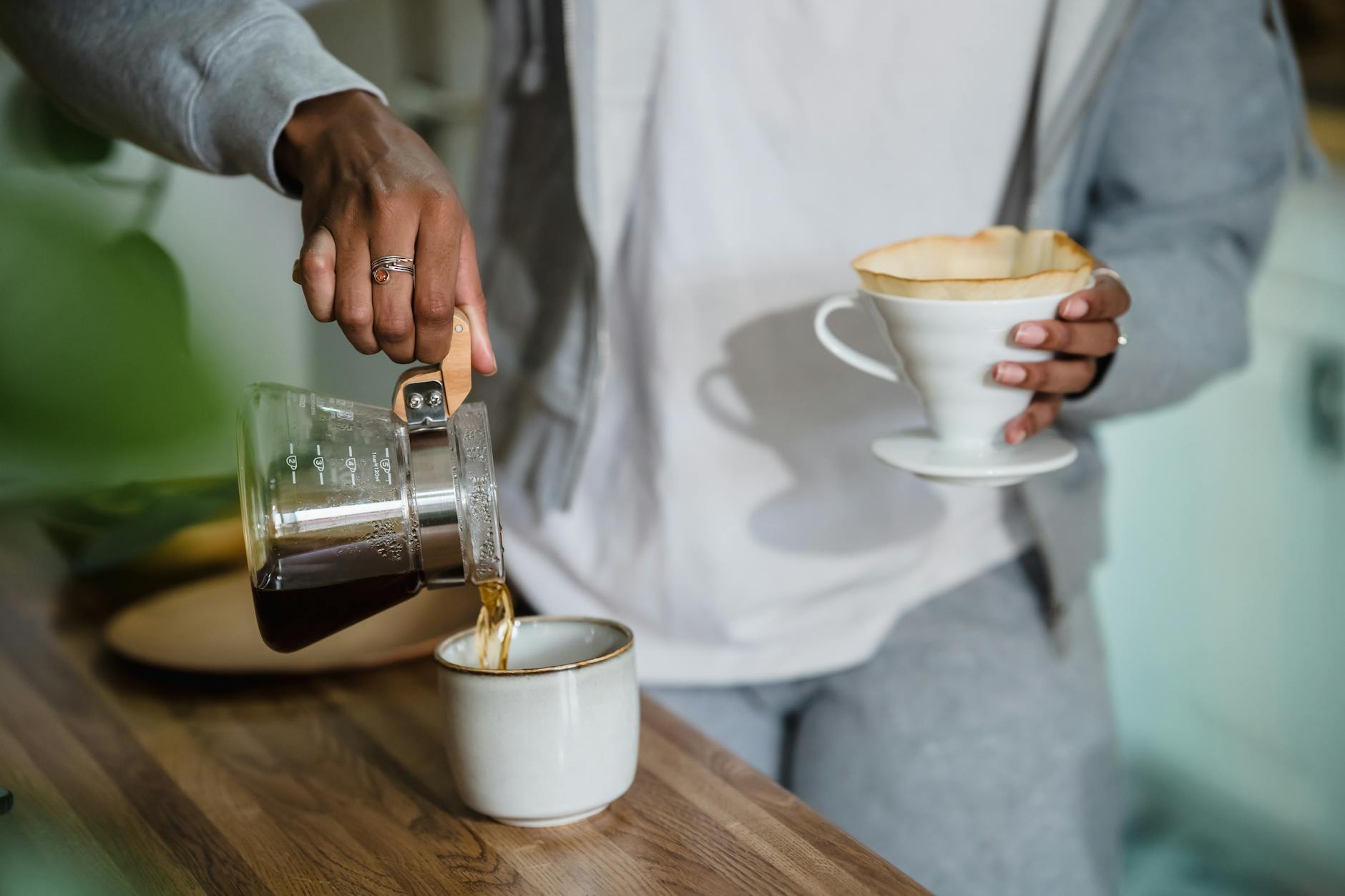 Coffee cup and smartphone on table during morning routine setup