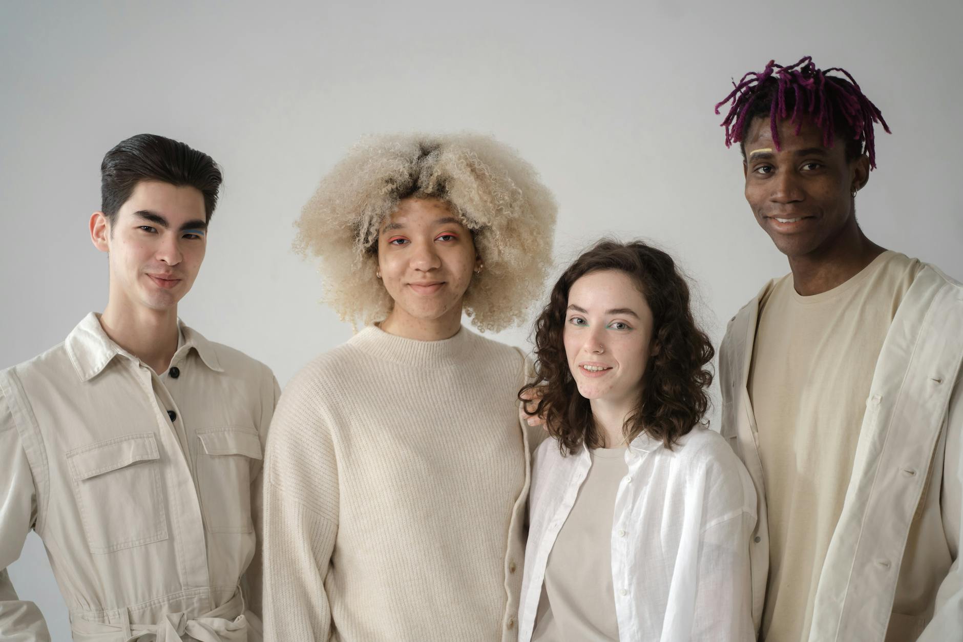 Diverse group of people in casual workout attire at fitness facility