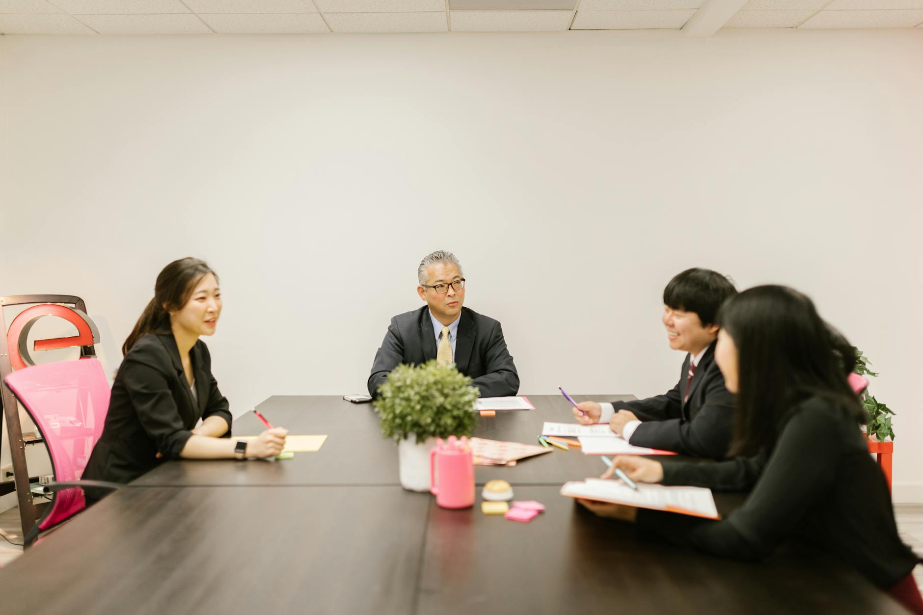 Business team having strategic discussion around conference table