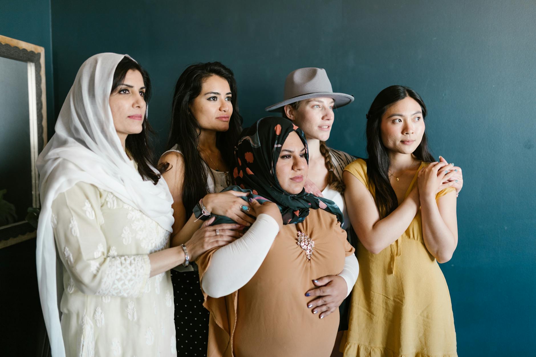 Group of diverse women of different ethnicities smiling together representing inclusive beauty community