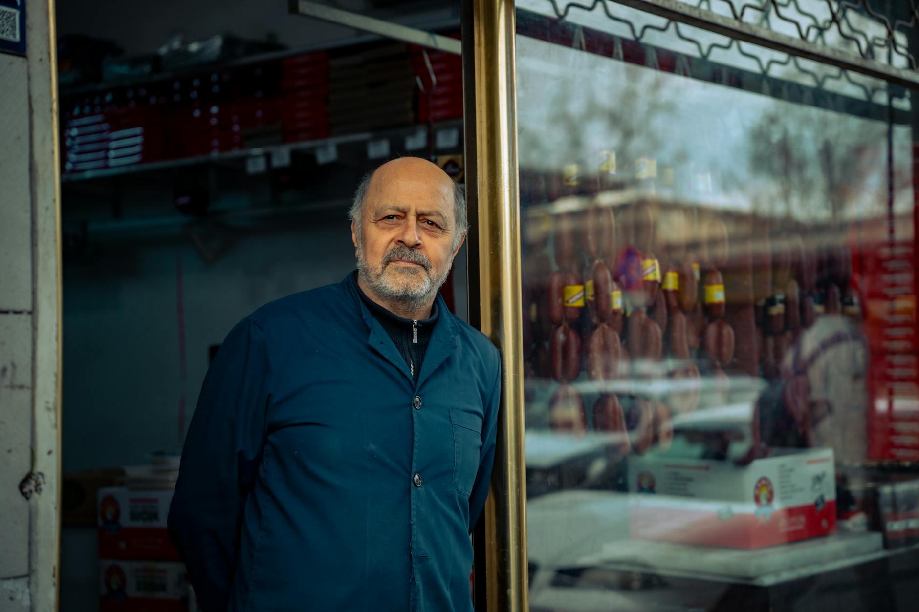 Small business owner working at counter, representing local retail operations