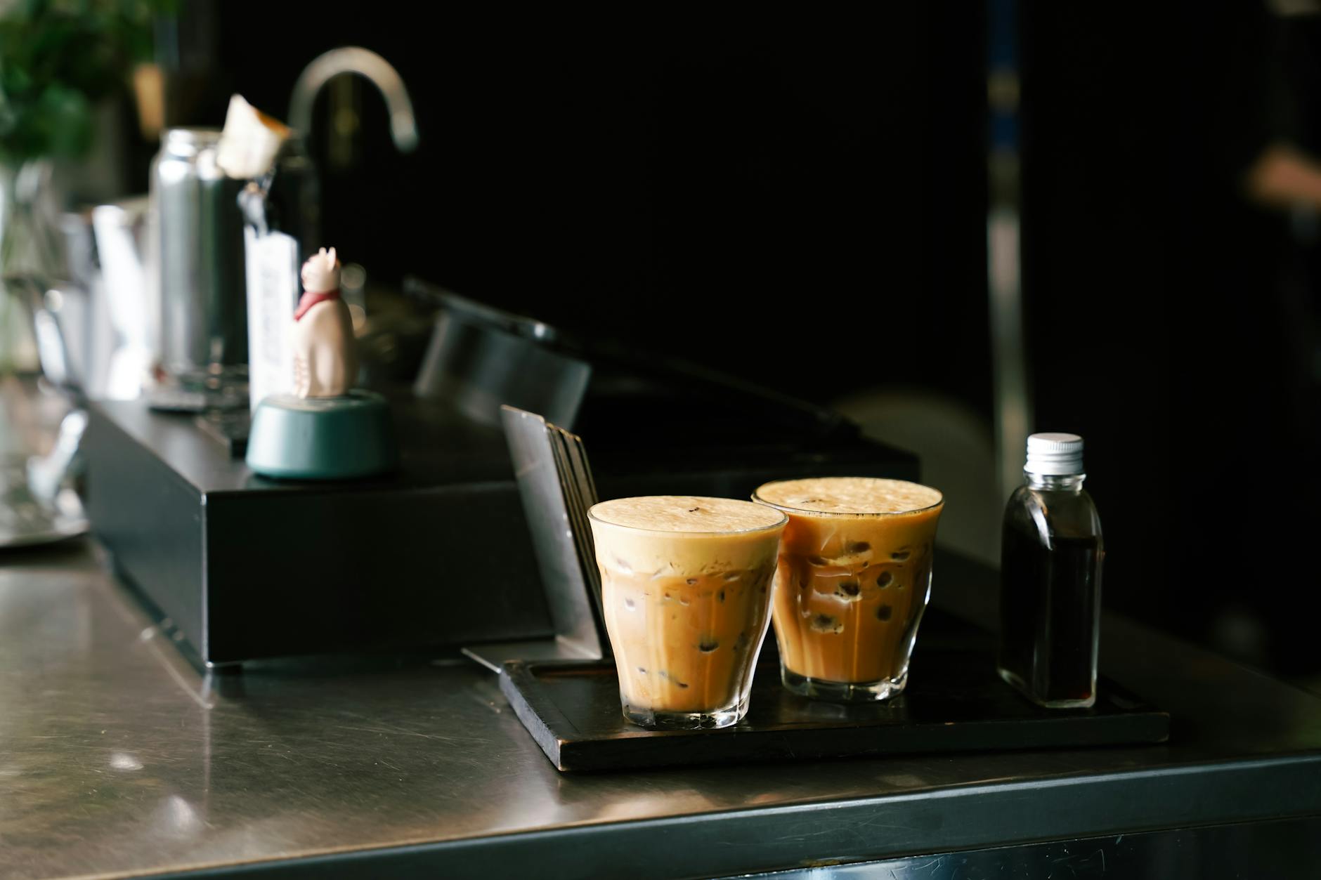 Cozy independent coffee shop interior with customers and barista