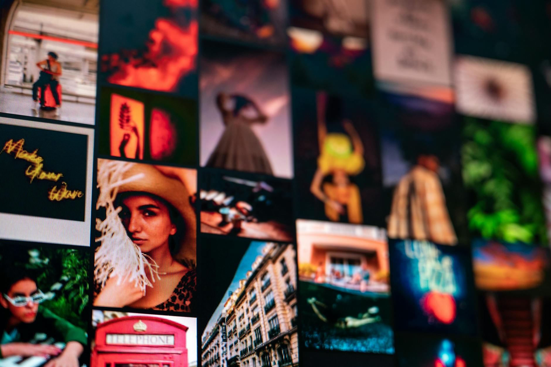 A creative desk workspace with overlapping magazine cutouts and mood board elements representing collage culture