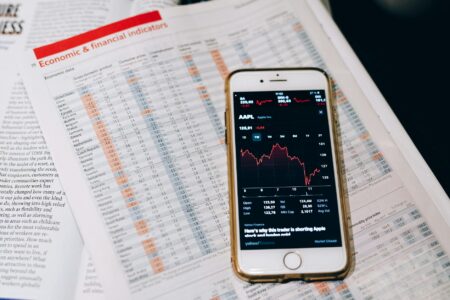 Smartphone displaying analytics dashboard with charts and performance metrics