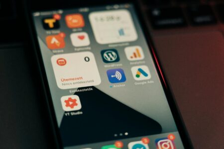 Person reviewing keyword analytics data on a smartphone screen
