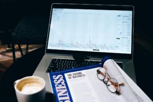 A person analyzing social media data on a laptop screen showing graphs and keyword metrics