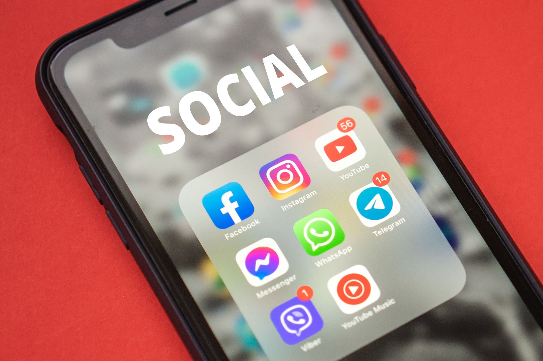 Person scrolling through social media content on a smartphone