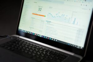 Computer screen displaying colorful analytics dashboard with charts and data visualizations