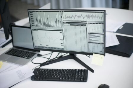Analytics dashboard displayed on computer screen showing social media metrics and graphs