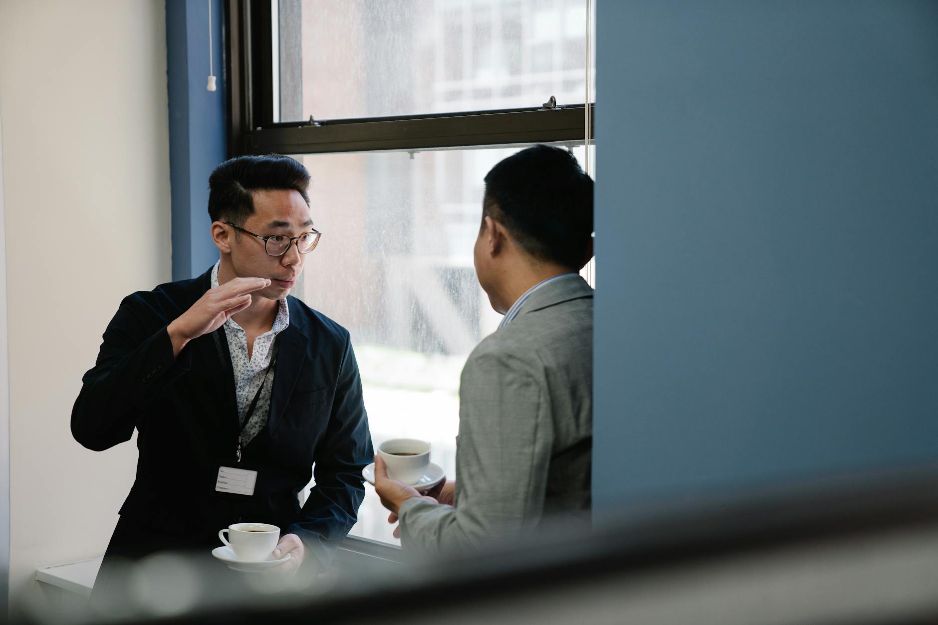 Two people having conversation over coffee representing community connection