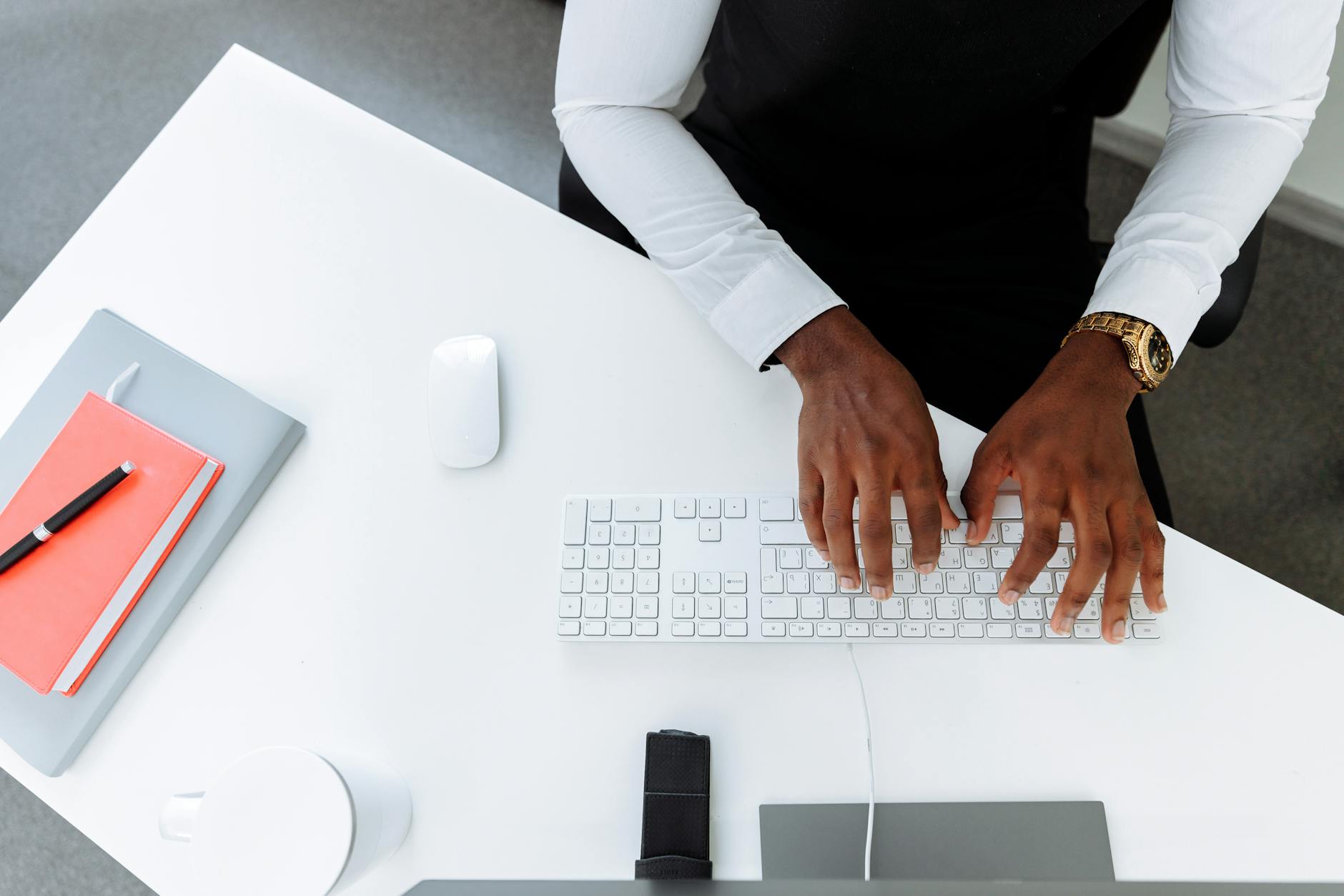 Professional typing on laptop creating content for a business platform