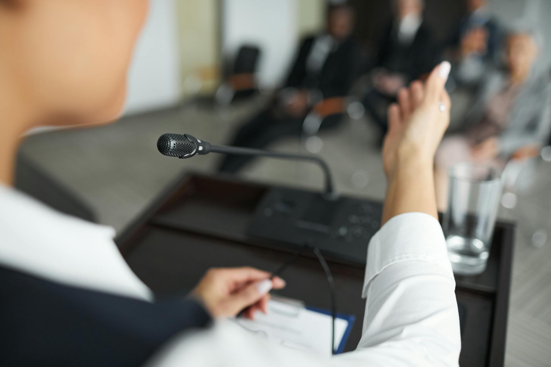 Business executive speaking to a professional audience, representing thought leadership in action