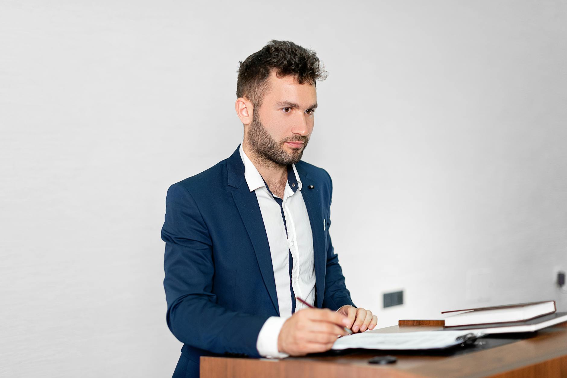 Business professional speaking at a desk, representing thought leadership content creation