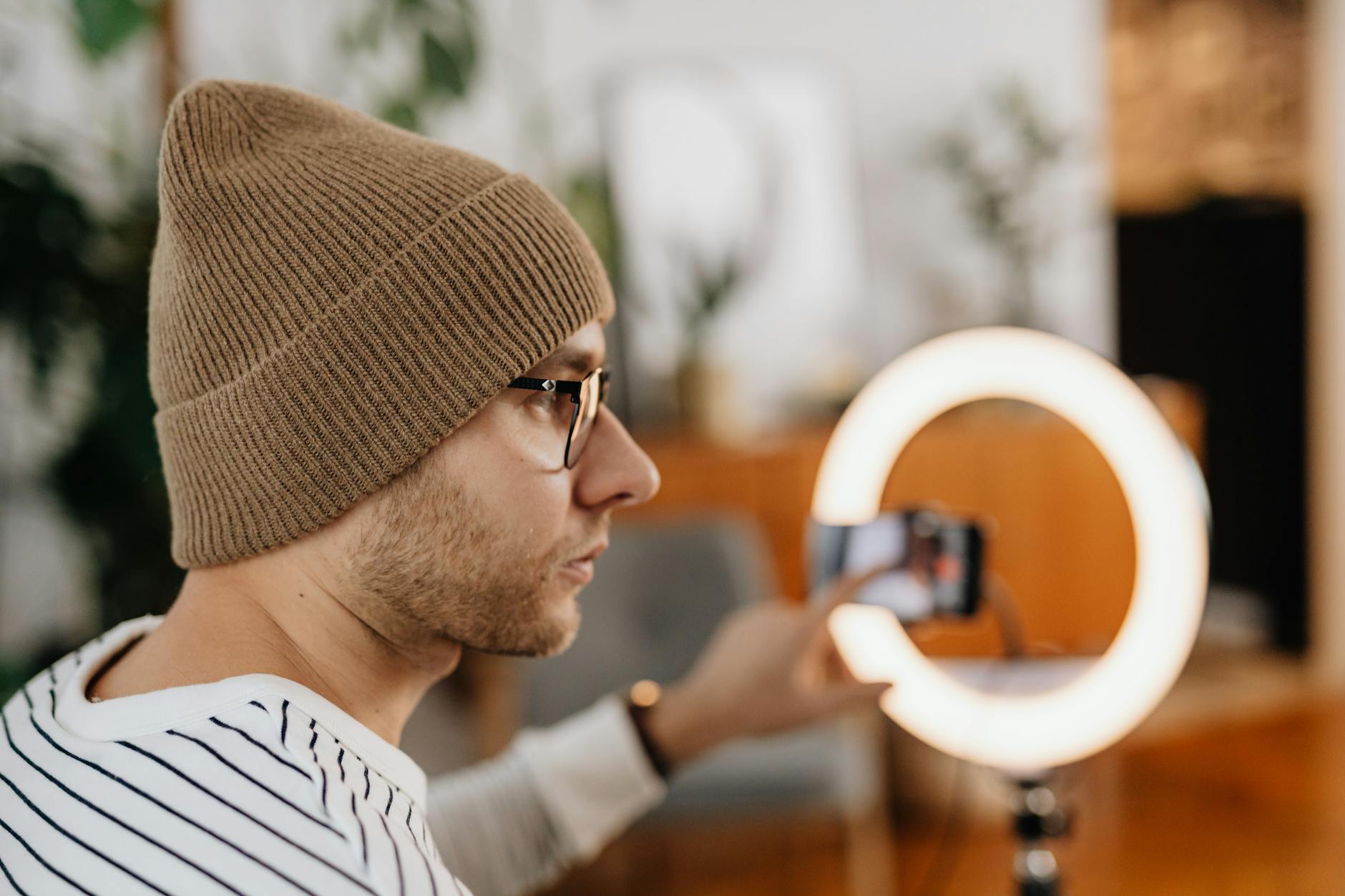 Creator reviewing video analytics on a laptop in a studio setup