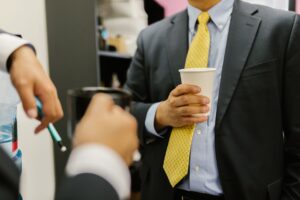 Professionals exchanging business cards and networking at a conference