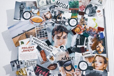 A creative mood board with layered images, color swatches, and design elements arranged on a flat surface