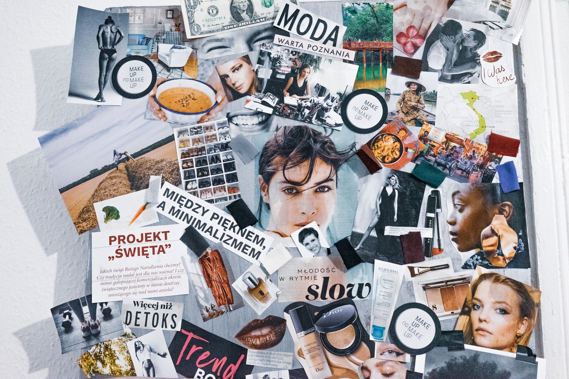 A creative mood board with layered images, color swatches, and design elements arranged on a flat surface