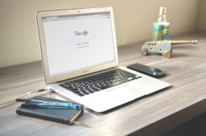 Person browsing the web and saving articles using a browser extension on a laptop