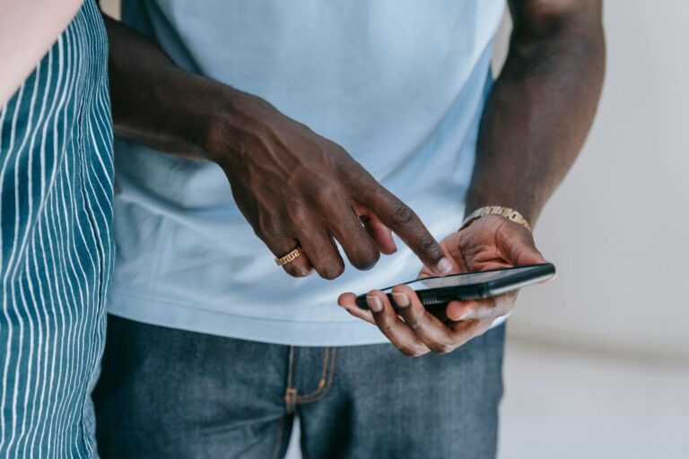 Person scrolling through short-form video content on a smartphone