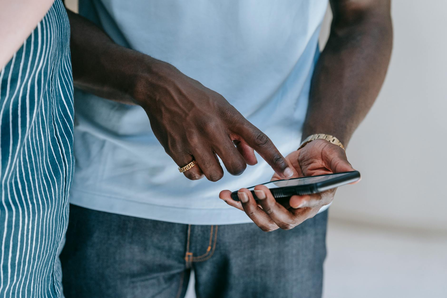 Person scrolling through short-form video content on a smartphone