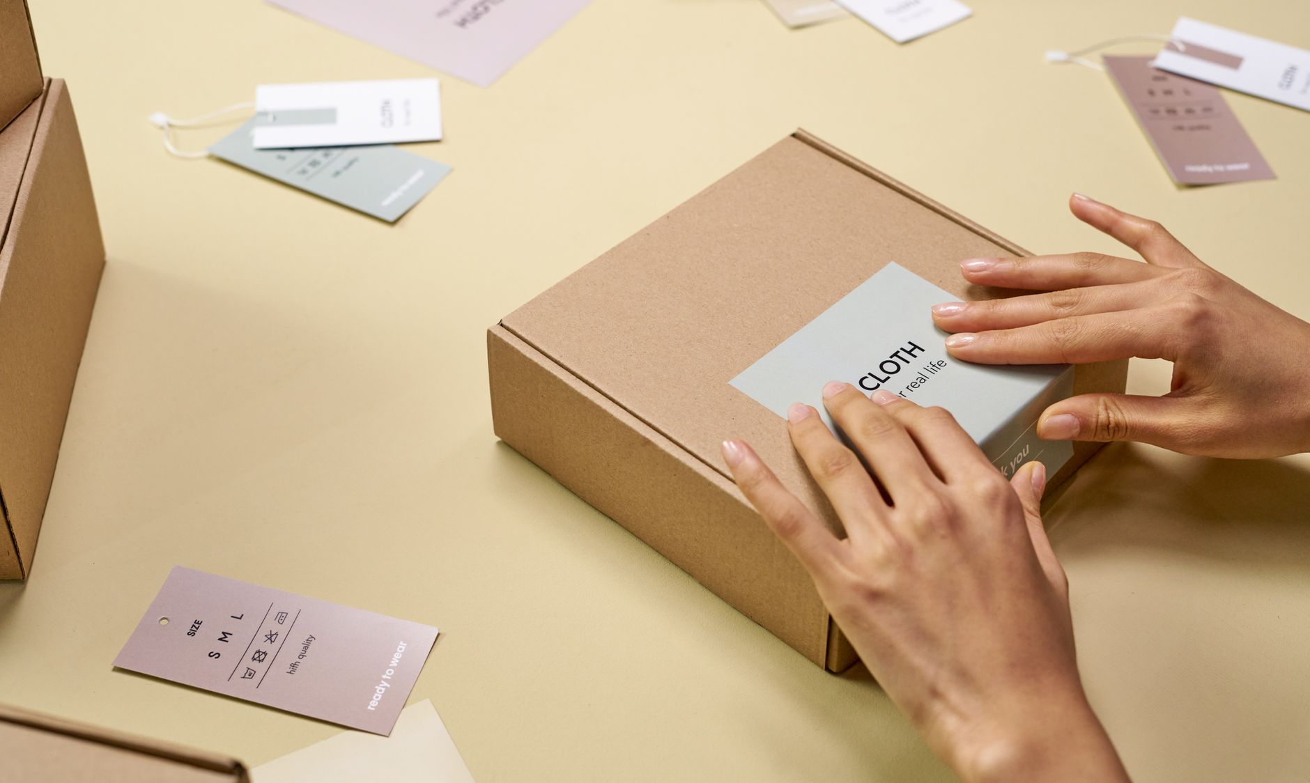 Small business owner packaging products for a limited drop sale