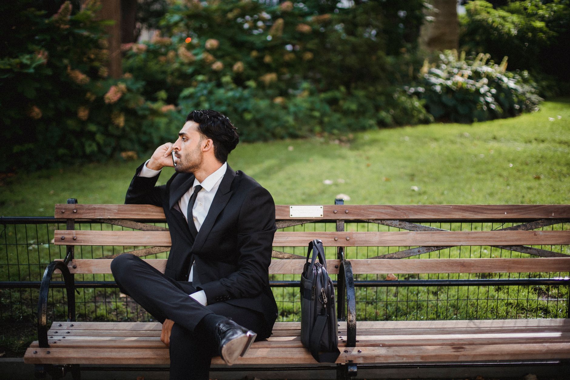 Professional speaking into a phone, representing voice-based communication in business