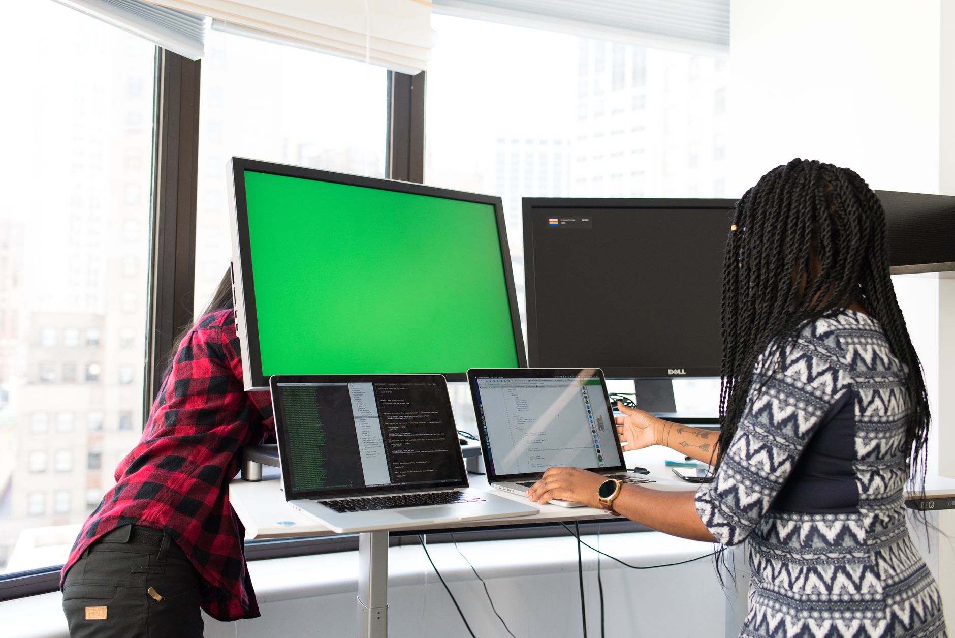 Team members reviewing content on a shared screen during a social media planning session