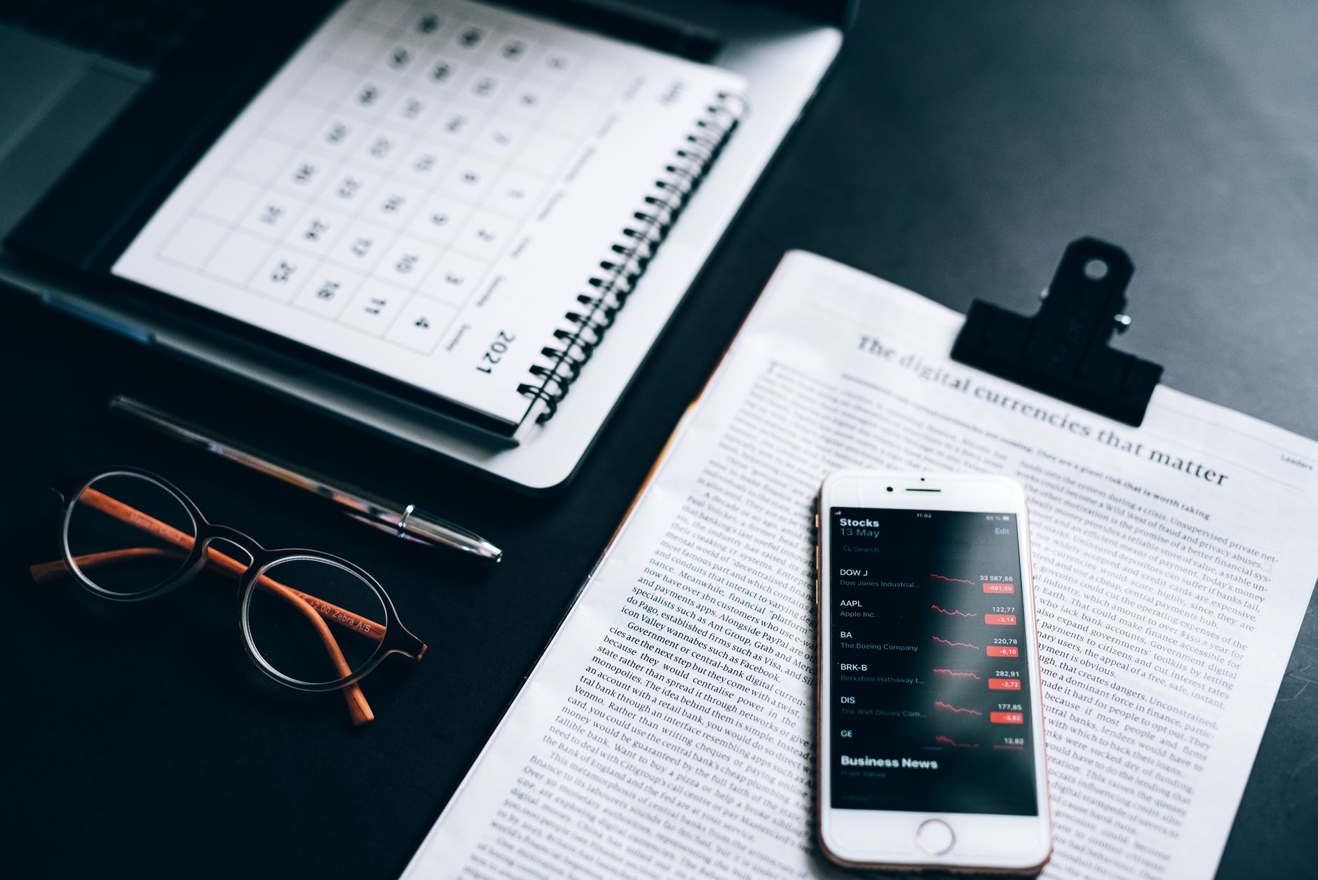 Marketing professional reviewing lead data on a computer screen at a desk