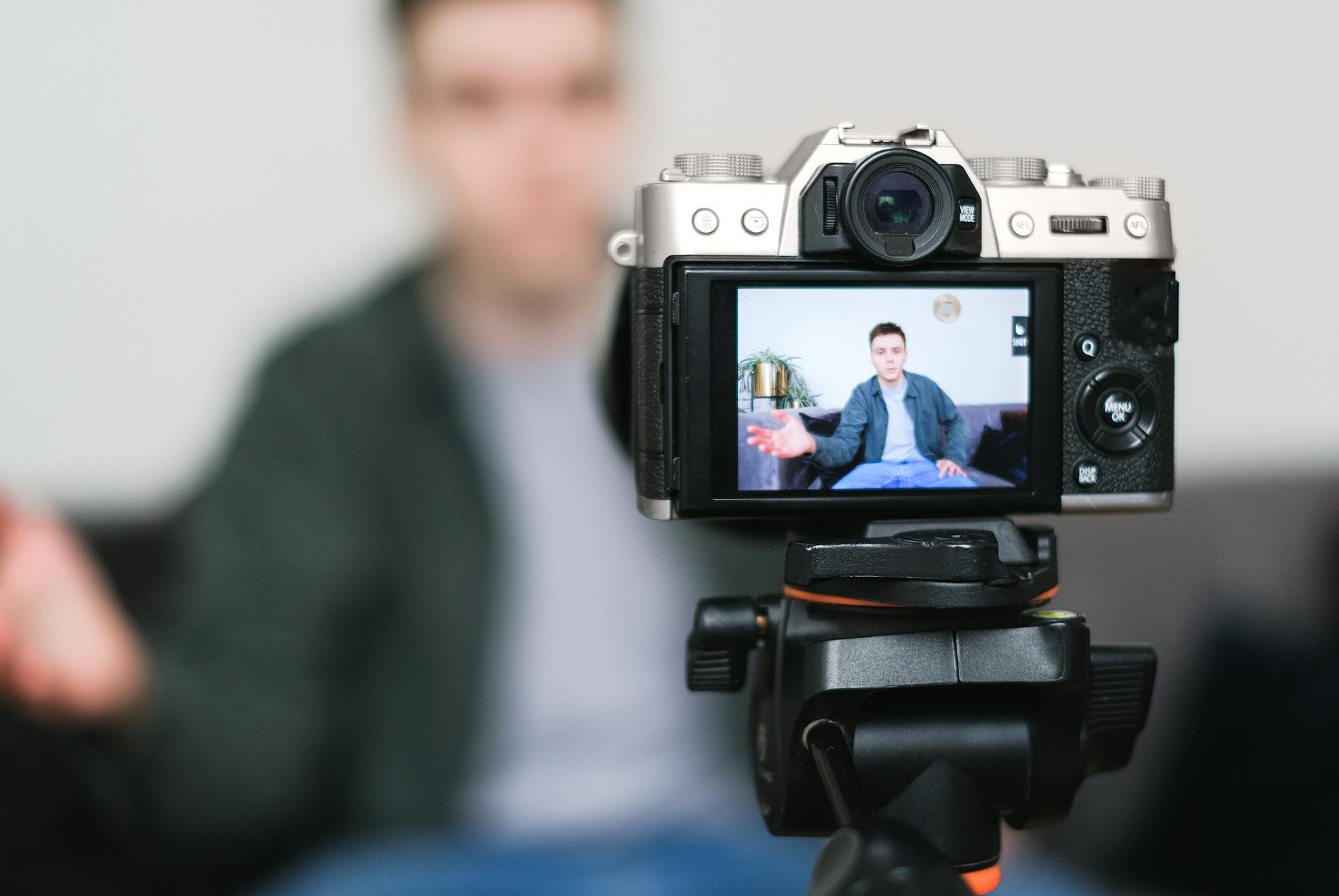 Creator filming a short-form video at a desk setup with camera and lighting