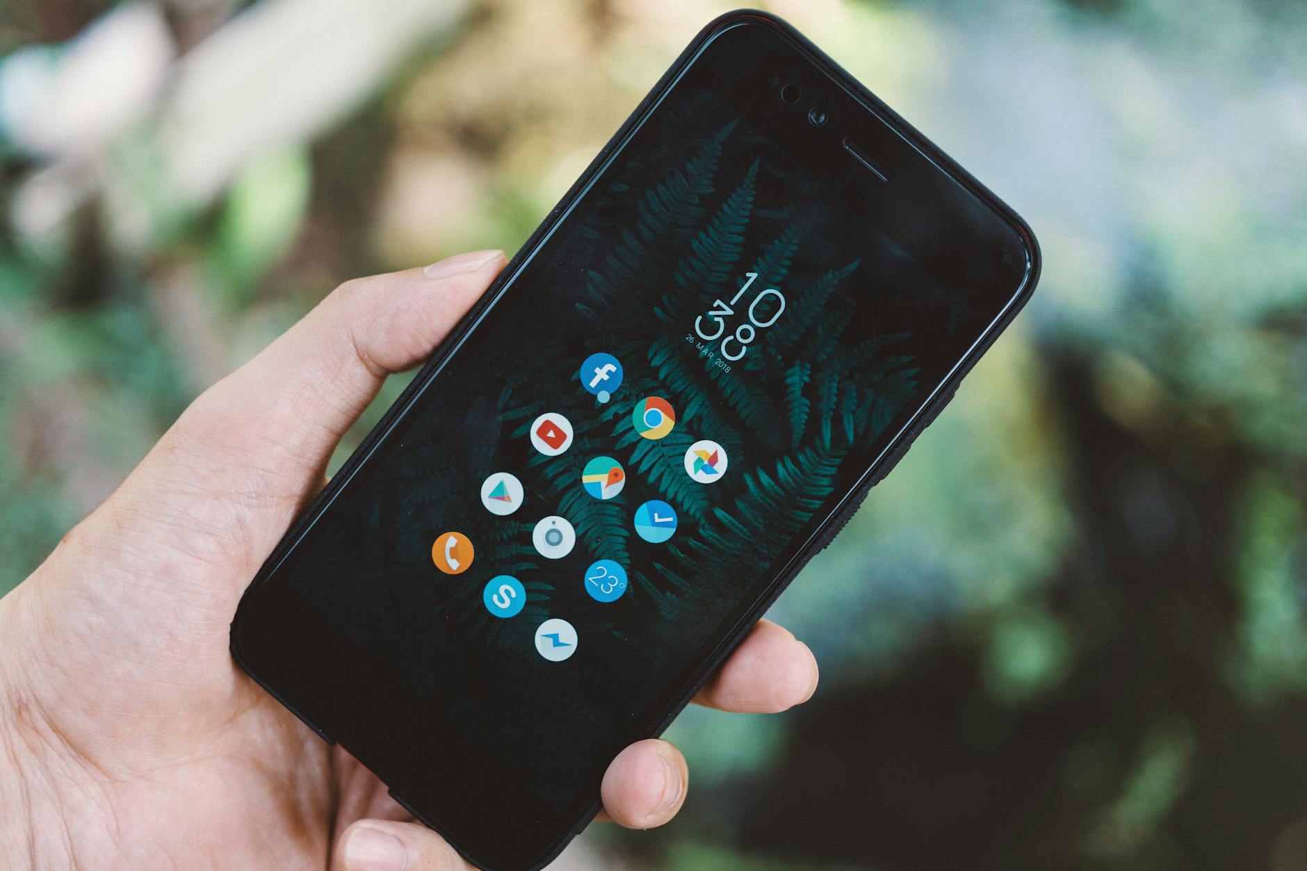 A smartphone displaying a mobile app interface with social platform statistics and follower data