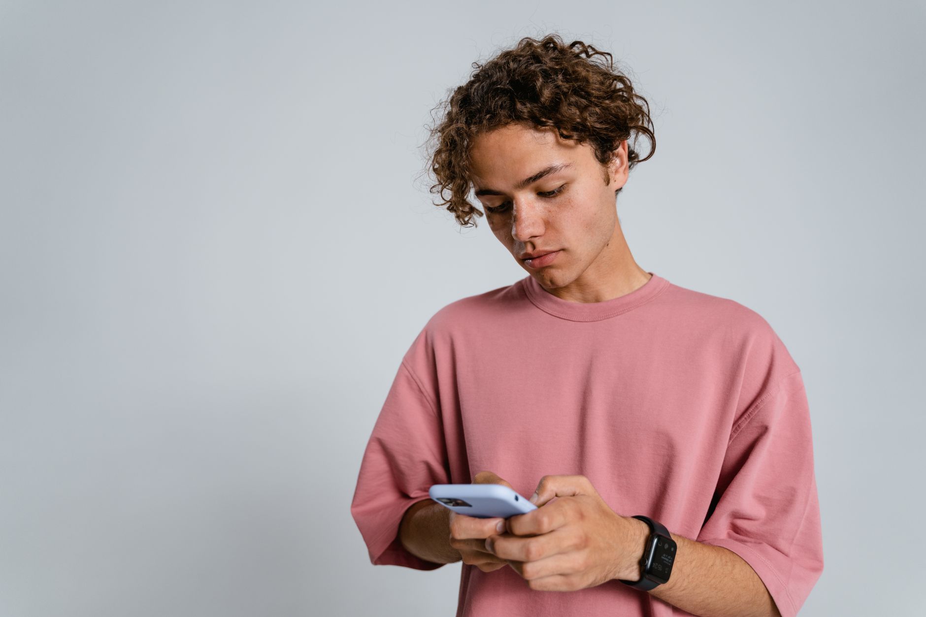 Young person using a smartphone app, representing Snapchat's core youth demographic