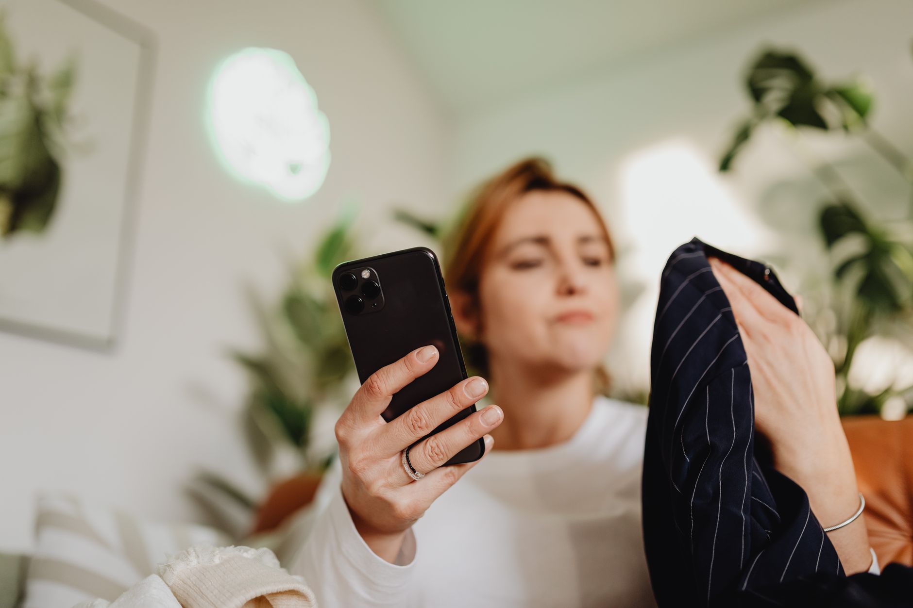 Woman using smartphone to browse and shop through social media