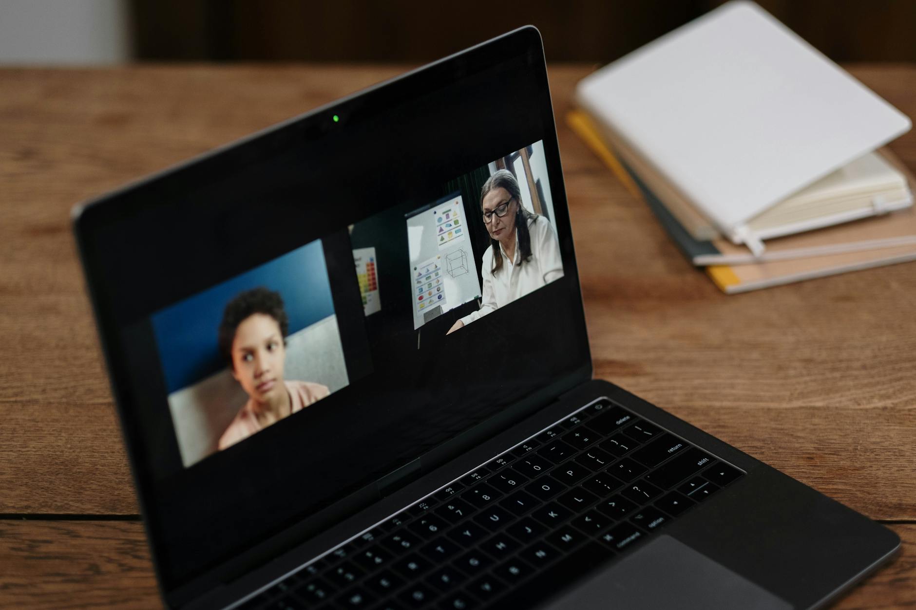 Small group attending an online video session on a laptop screen