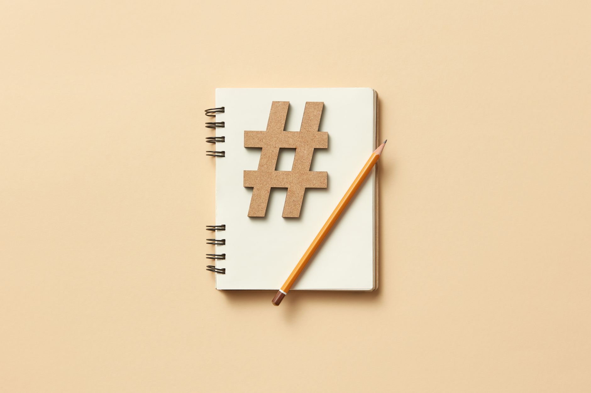 Marketing professional reviewing a social media content calendar on a laptop