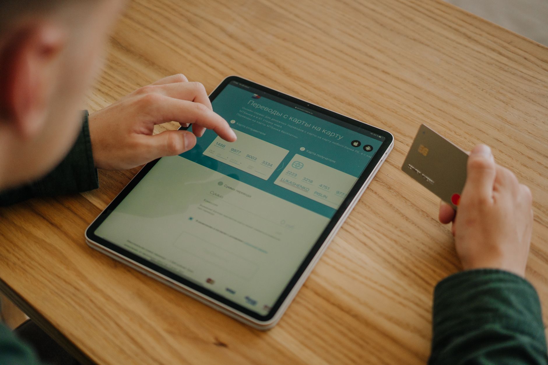 Person entering payment information on a laptop for an online subscription service