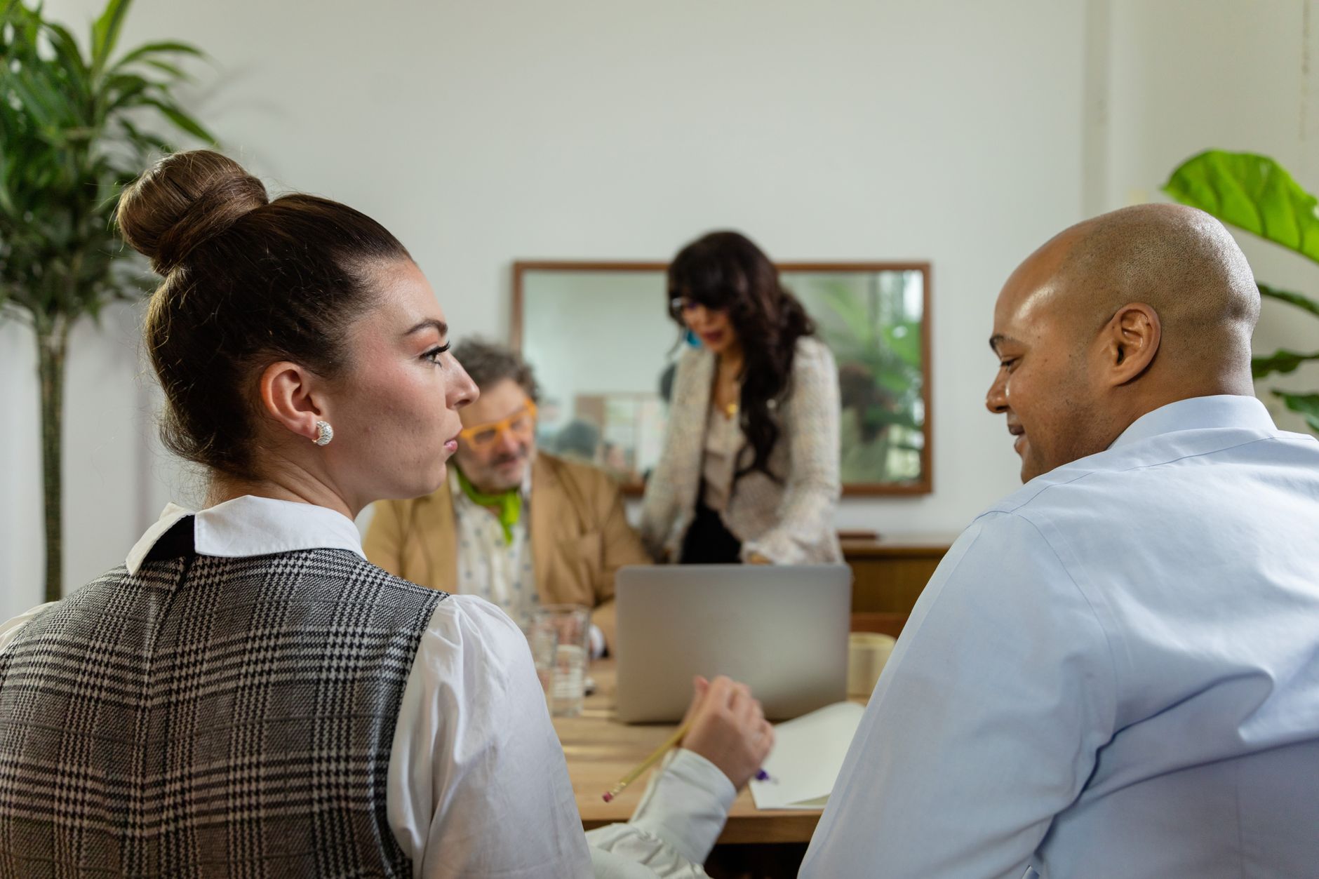 Two professionals reviewing a digital networking platform on a tablet