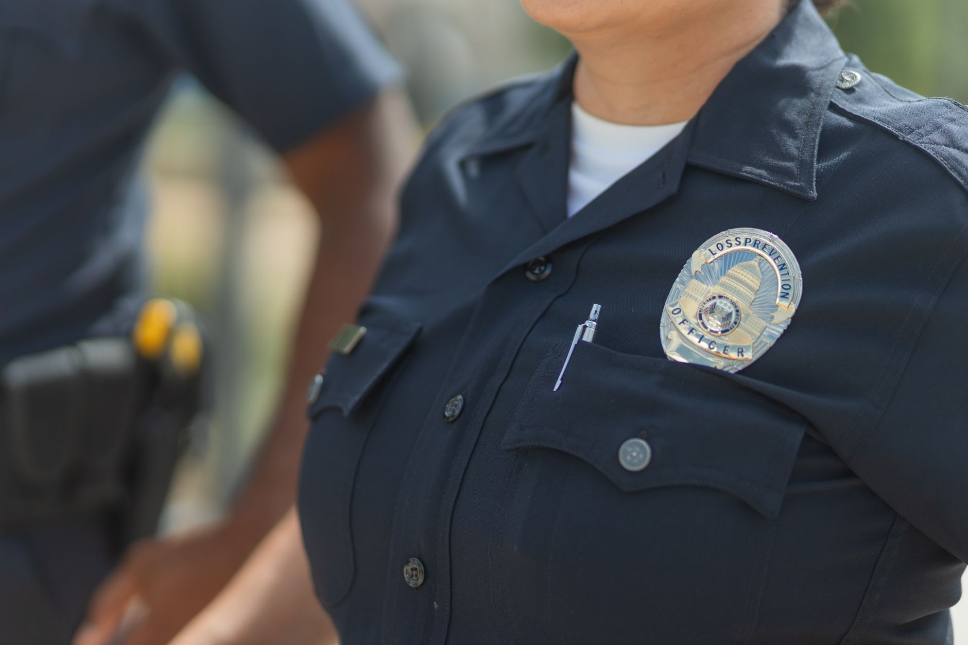 Person reviewing digital credentials and professional badges on tablet