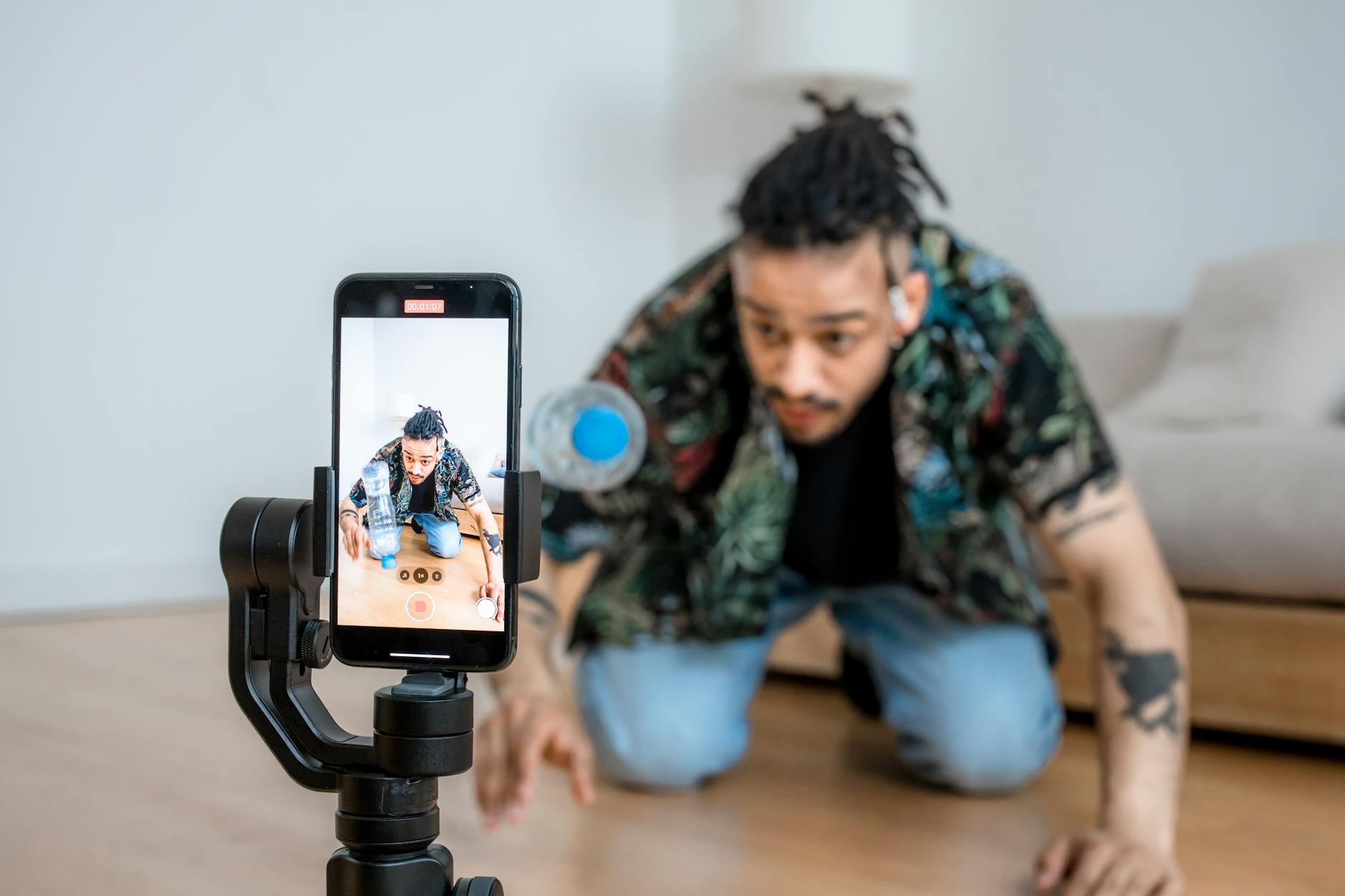 Creator recording a video tutorial with a smartphone and ring light