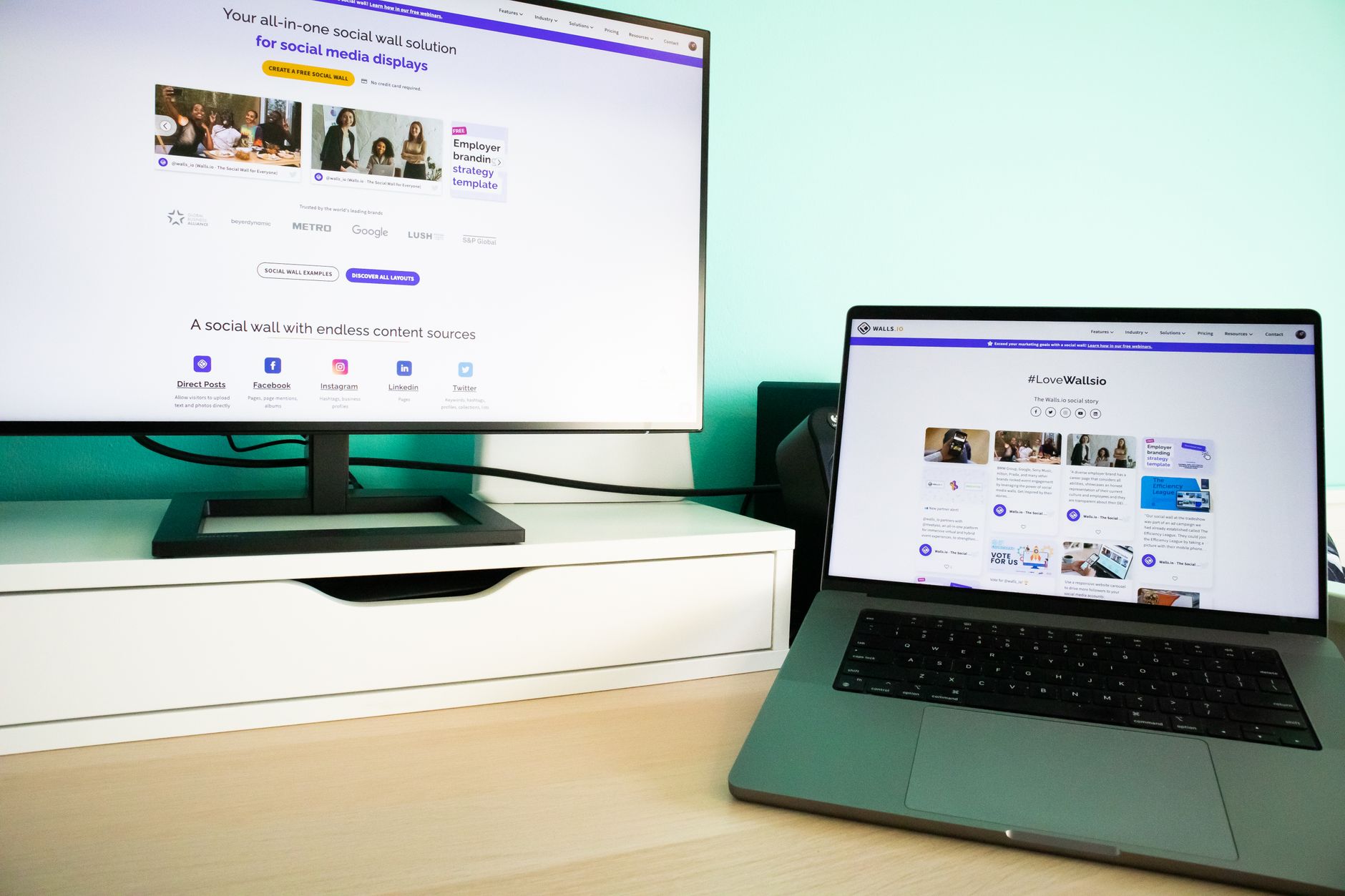 Community manager working at a desk reviewing social media comments on a computer screen