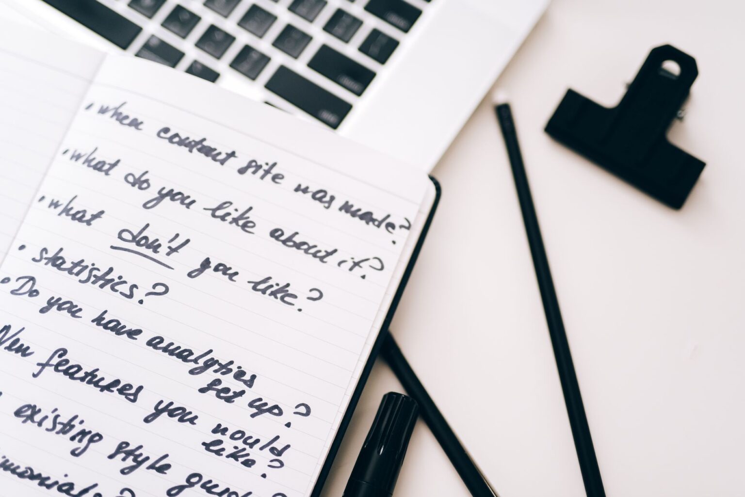 Notion’s AI Project Tracker Is Quietly Replacing Asana for Creators A creator working at a desk with a laptop and project notes spread out