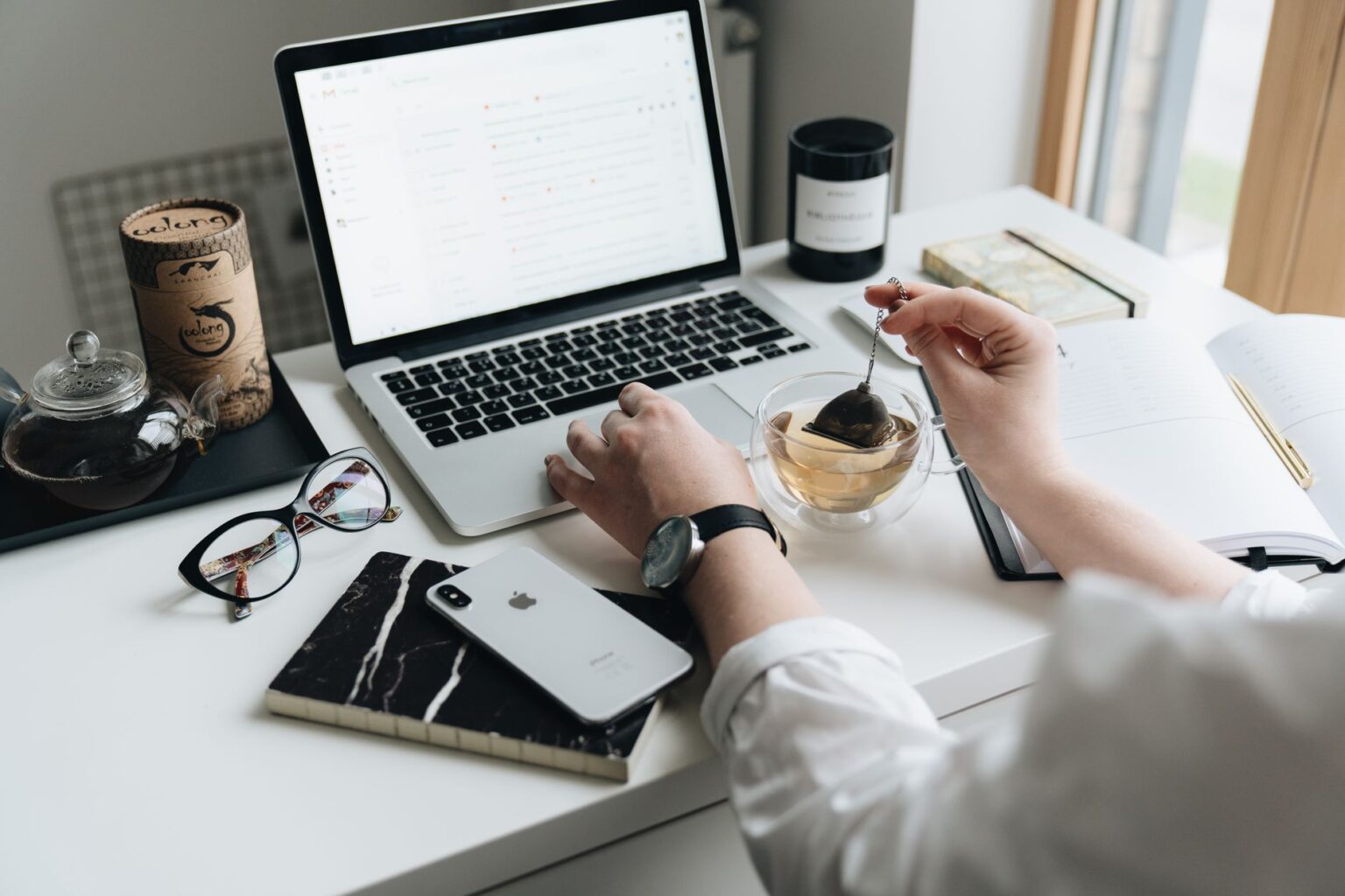 A writer working on a newsletter at a clean desk workspace