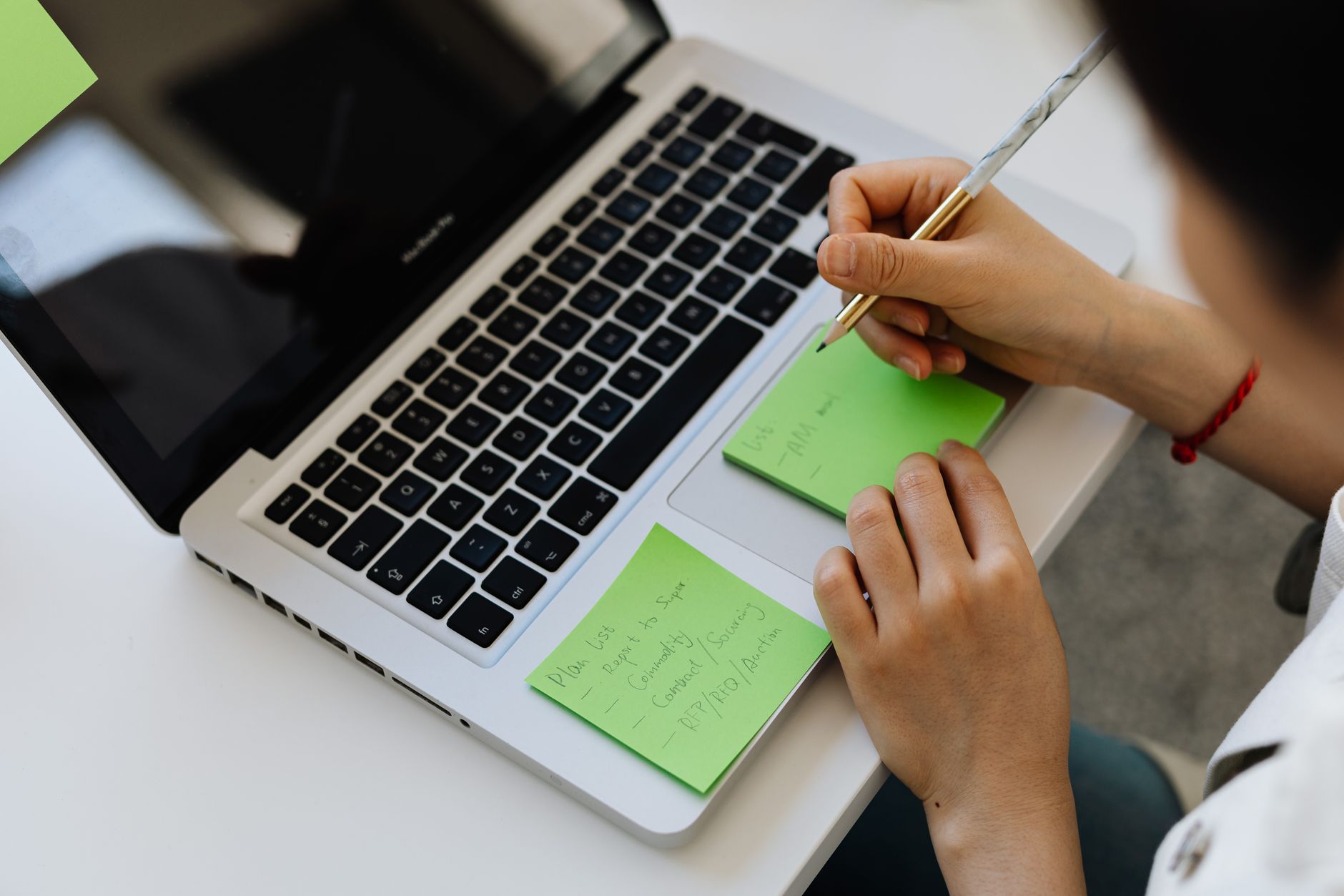 Open laptop on a clean desk with a digital document showing meeting notes