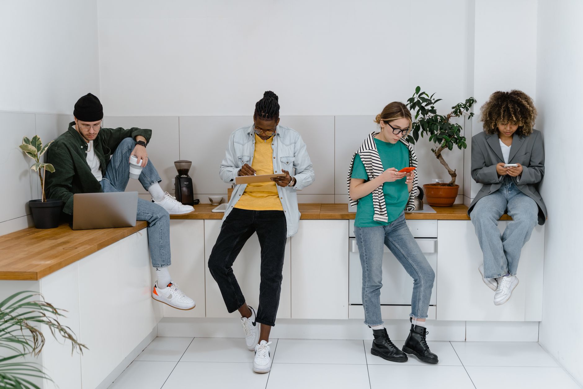 Social media team members reviewing screen recordings and annotated screenshots at a shared desk