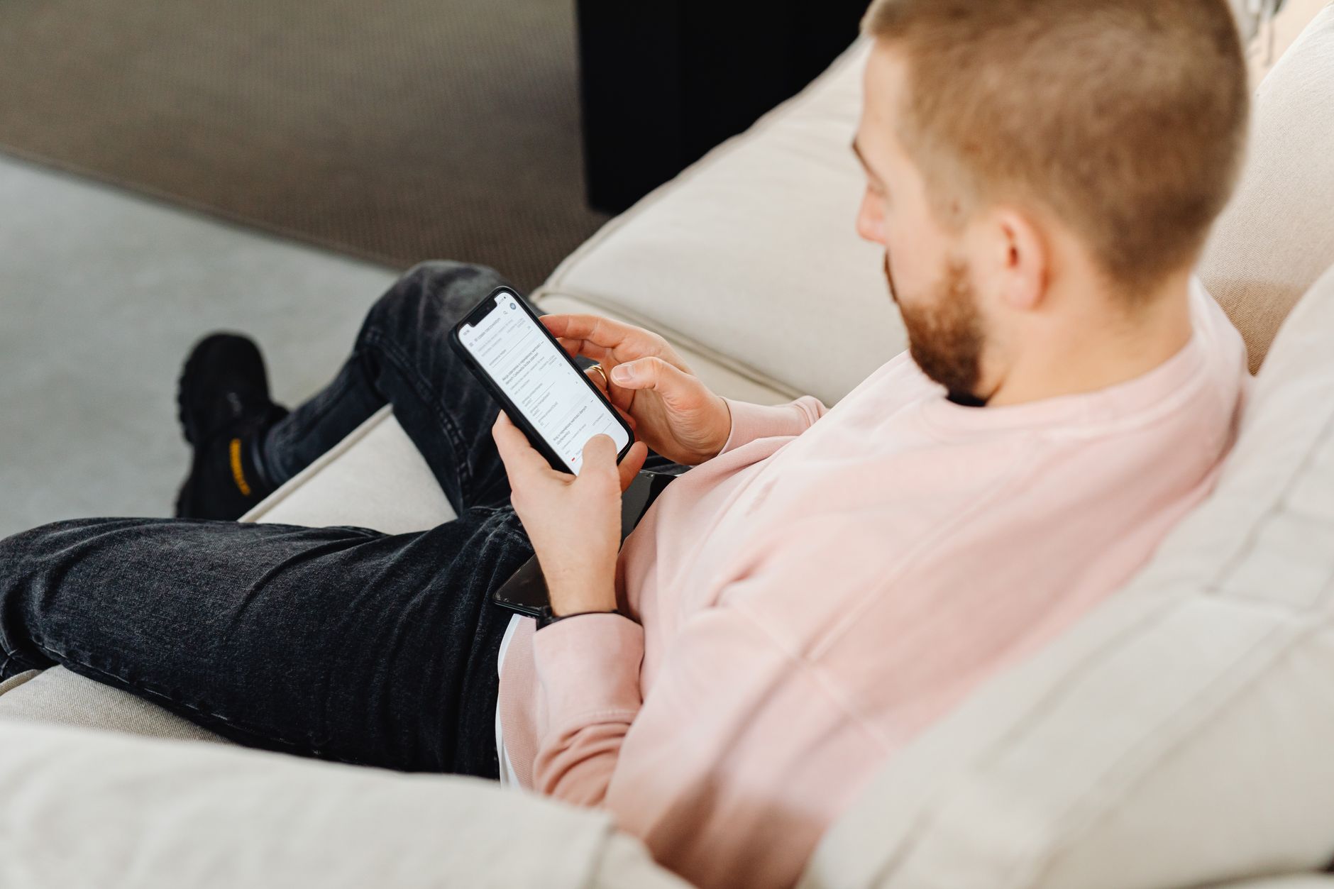 Person reading content on a smartphone, representing engaged newsletter audiences