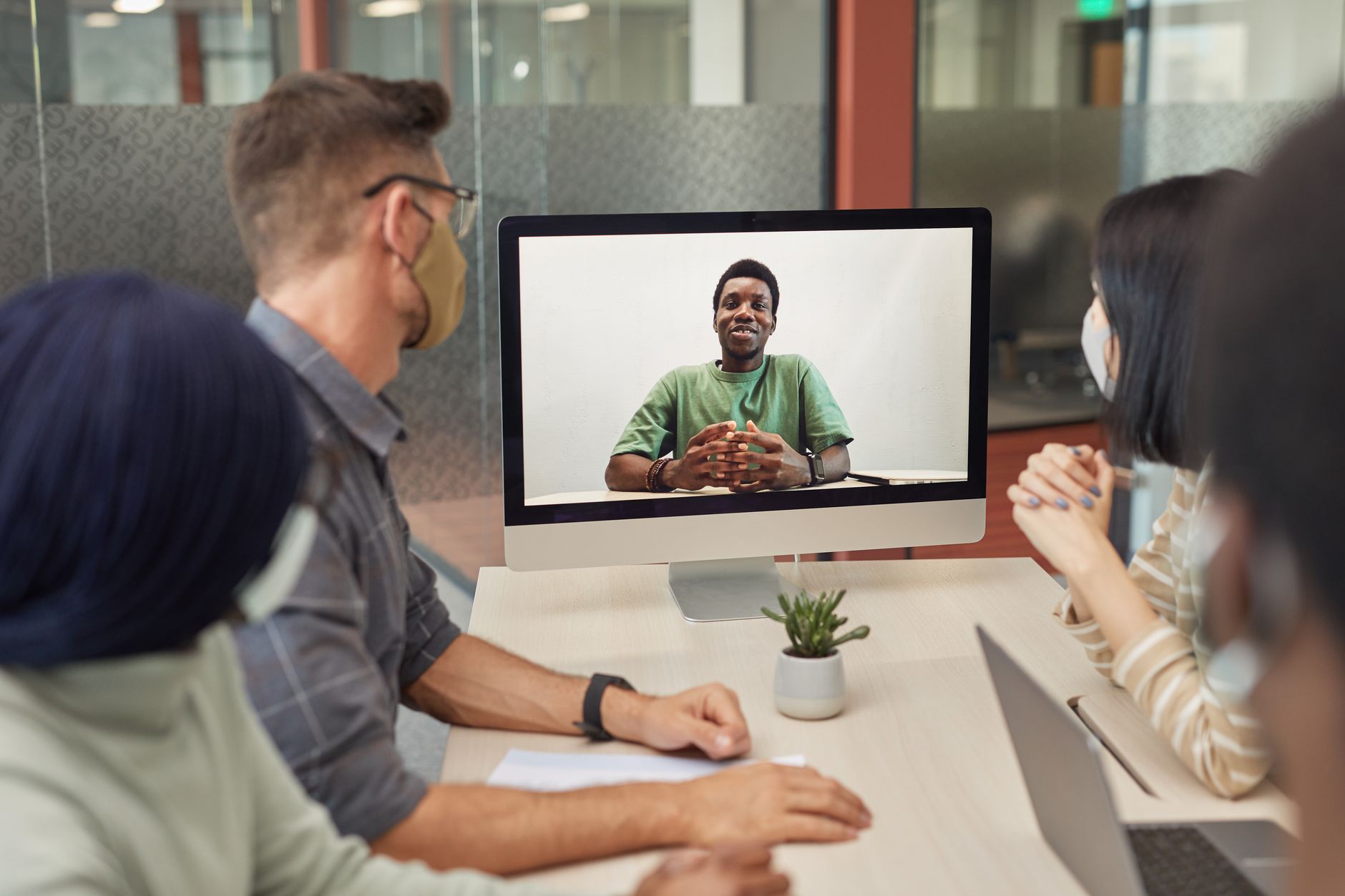 Two people on a video call working remotely on a shared project